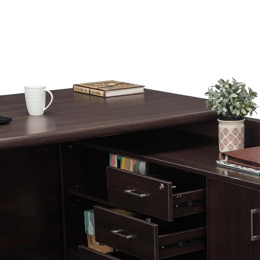 https://www.lakdi.com/products/director-l-shape-table-made-in-pre-laminated-particle-board-matte-finish-and-brown-smoke-oak-color