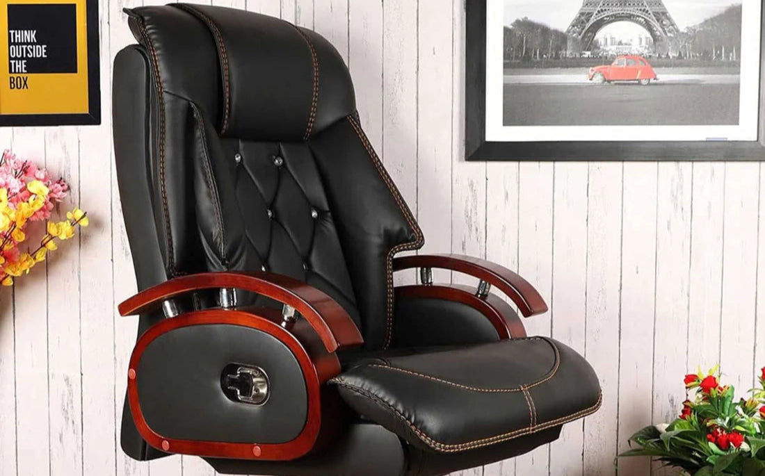 Black office chair with wooden accents in a room with decor elements.